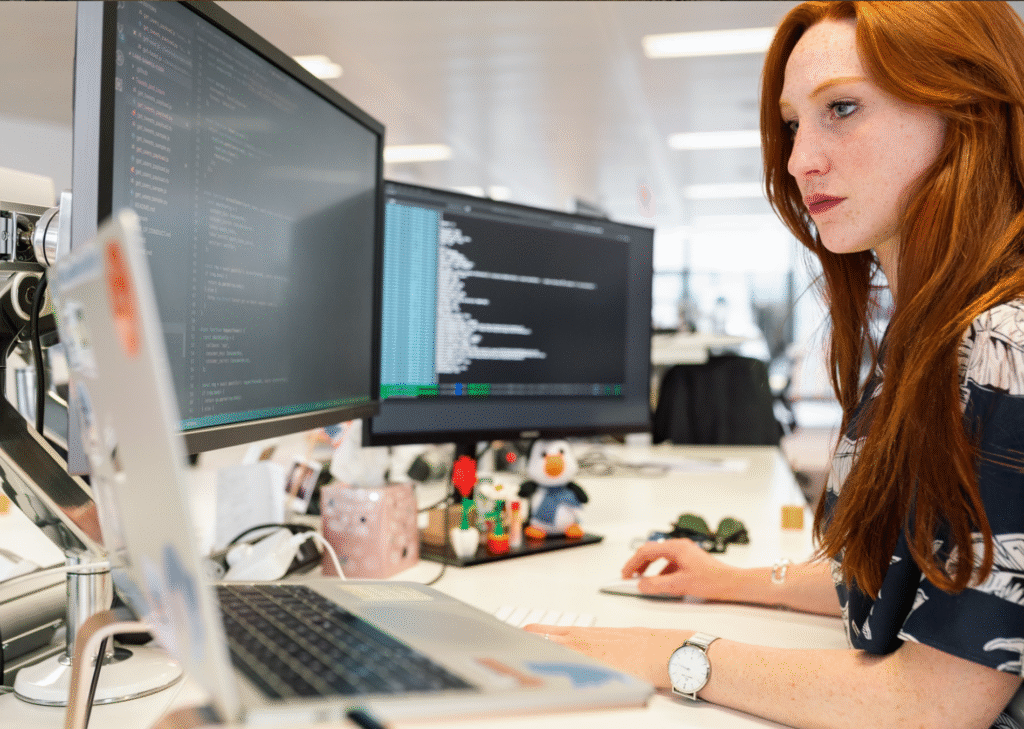 Data science and machine learning professional working at computer